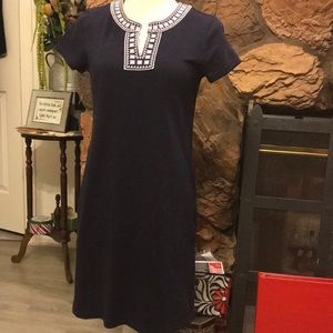 Navy blue knit dress with embroidered trim at neckline with V front